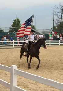 The American flag carried out at the end of the Breeds Barn show at Kentucky Horse Park. Photo by D Jørgensen.